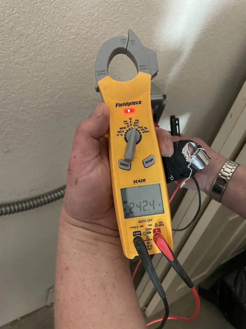 Voltage testing with clamp meter during Electrical Installation Services in Fleetwood